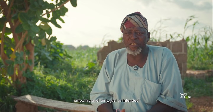 A farmer reflects on support for cultivation in Talata Mafara. Film still.