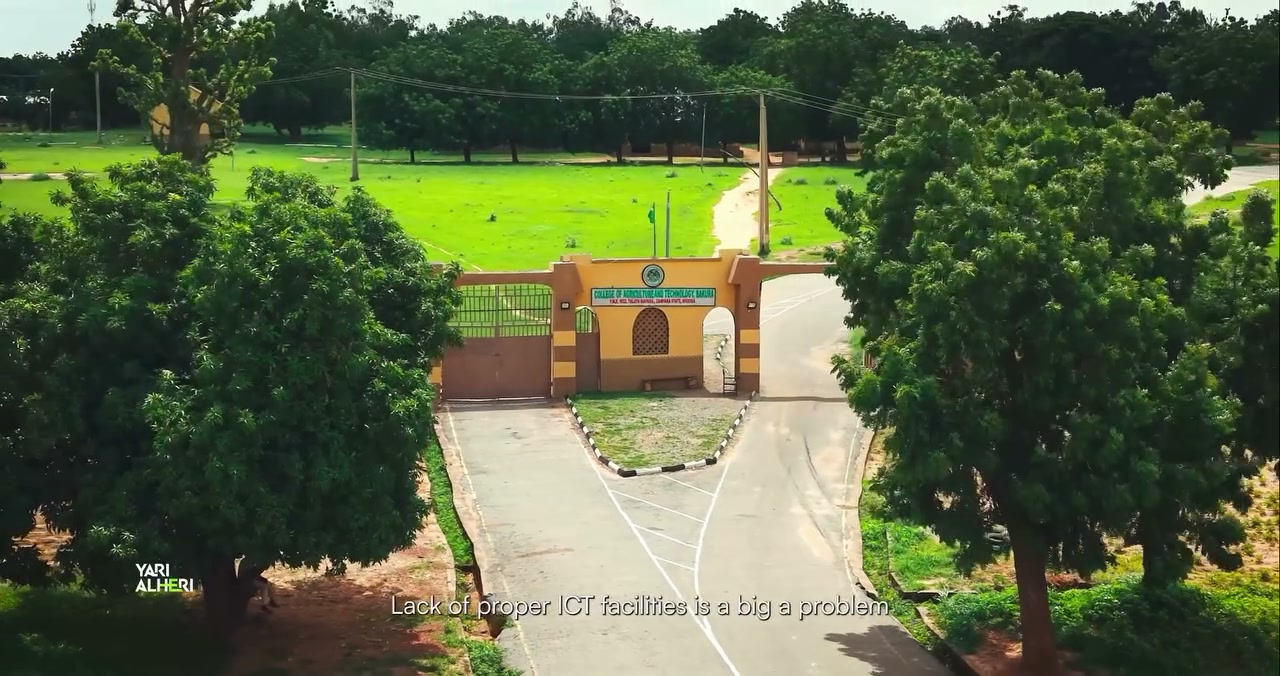 A college representative discusses ICT support in Bakura. Film still.