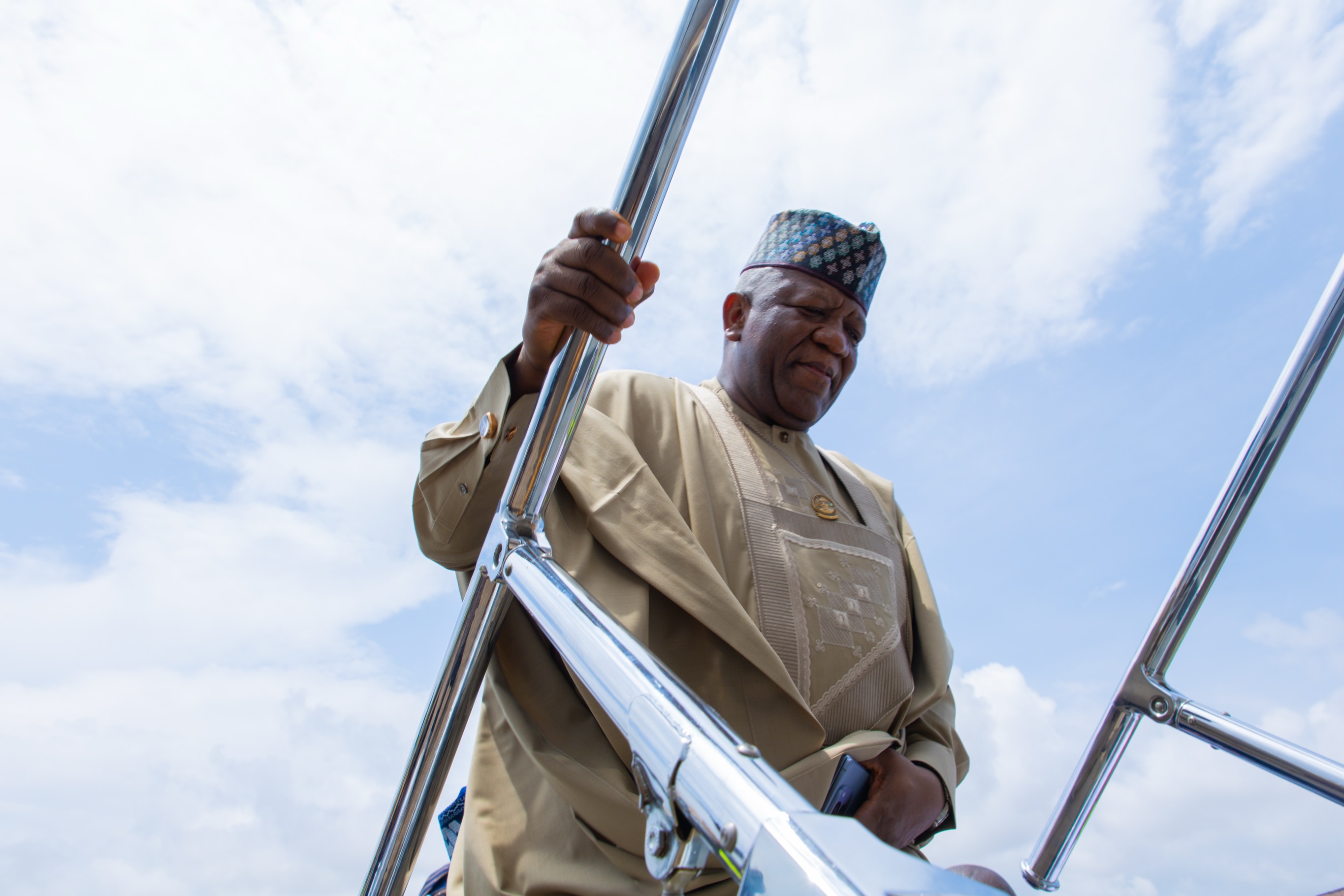 Senator Abdulaziz Yari at the aircraft steps during the Benin engagement.