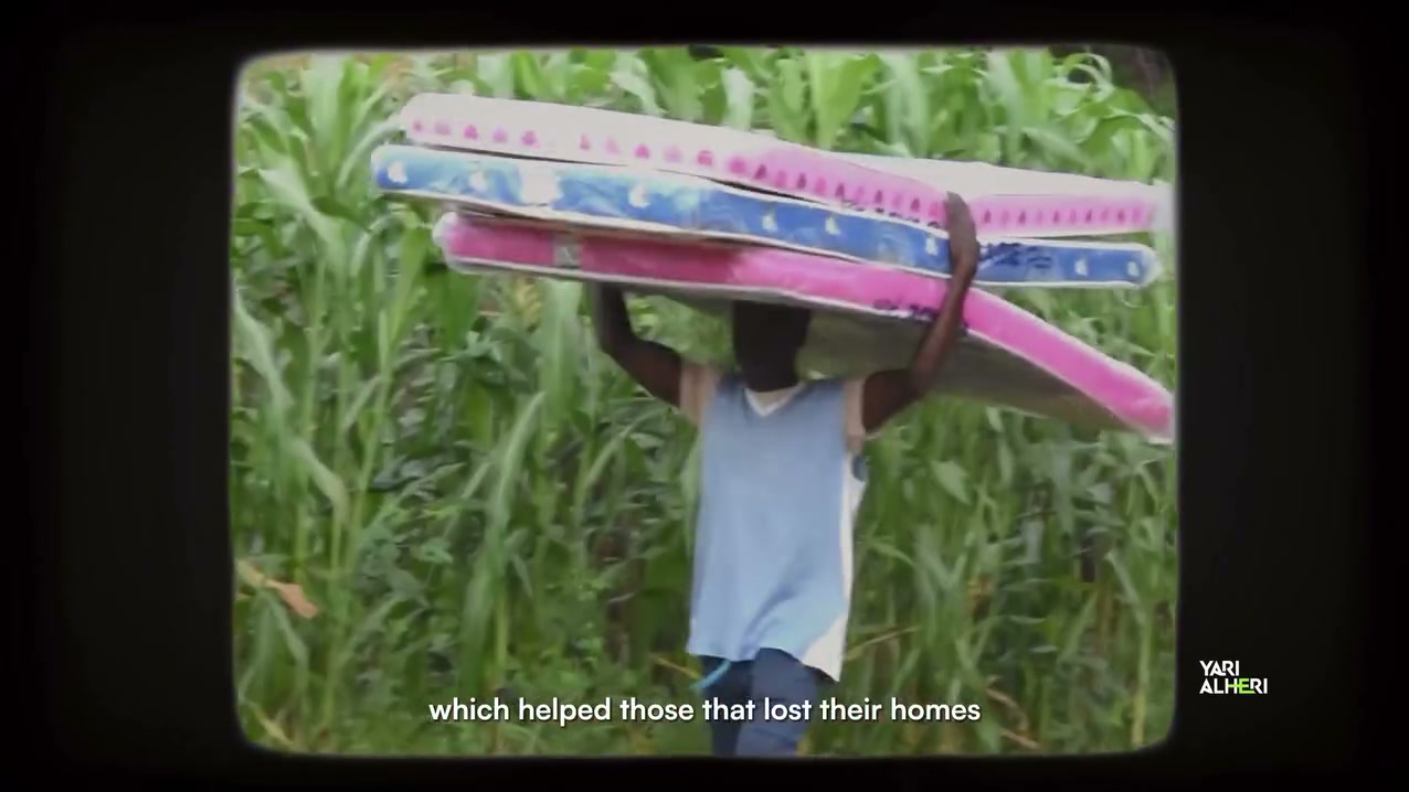 Community voices and rebuilding scenes from Gummi’s flood recovery. Film still.